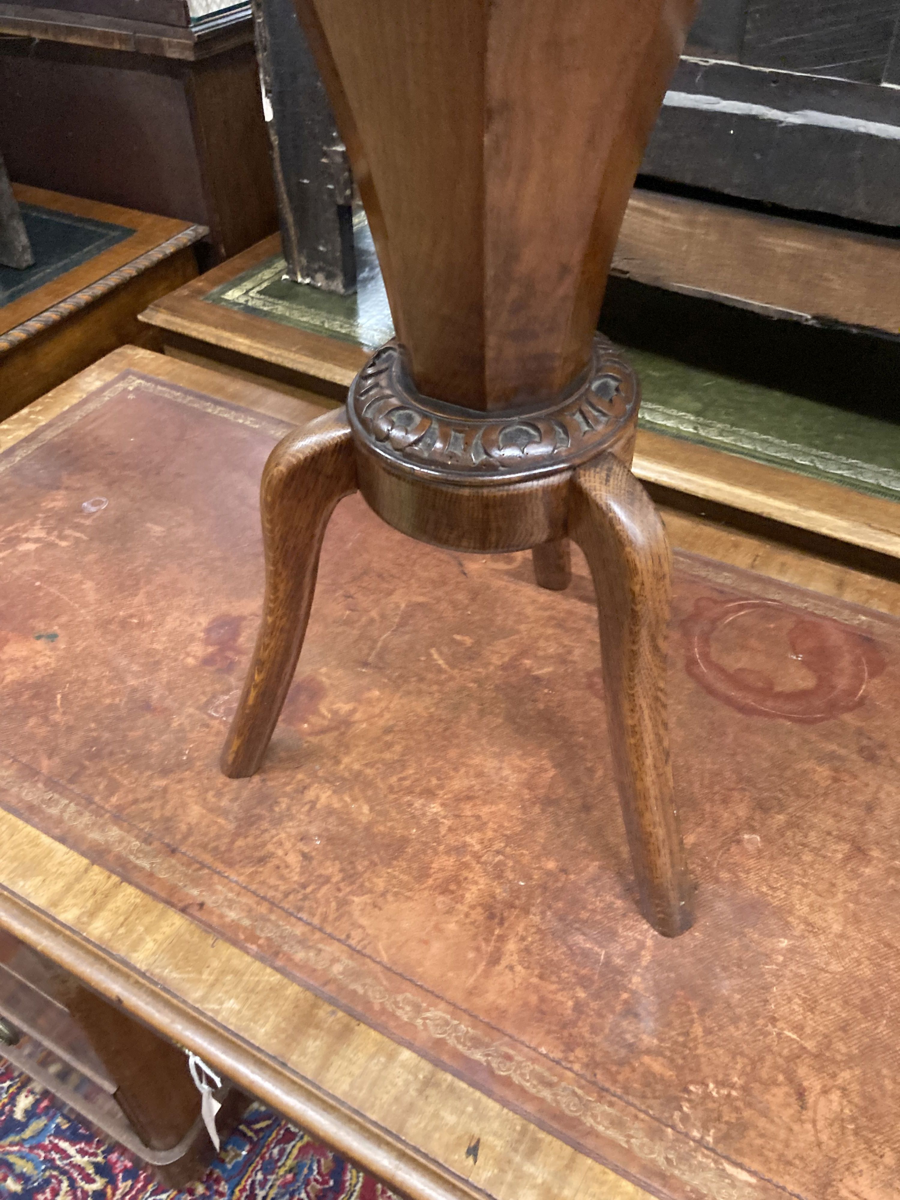 A Victorian walnut trumpet shaped work table on later oak supports, width 44cm, height 70cm